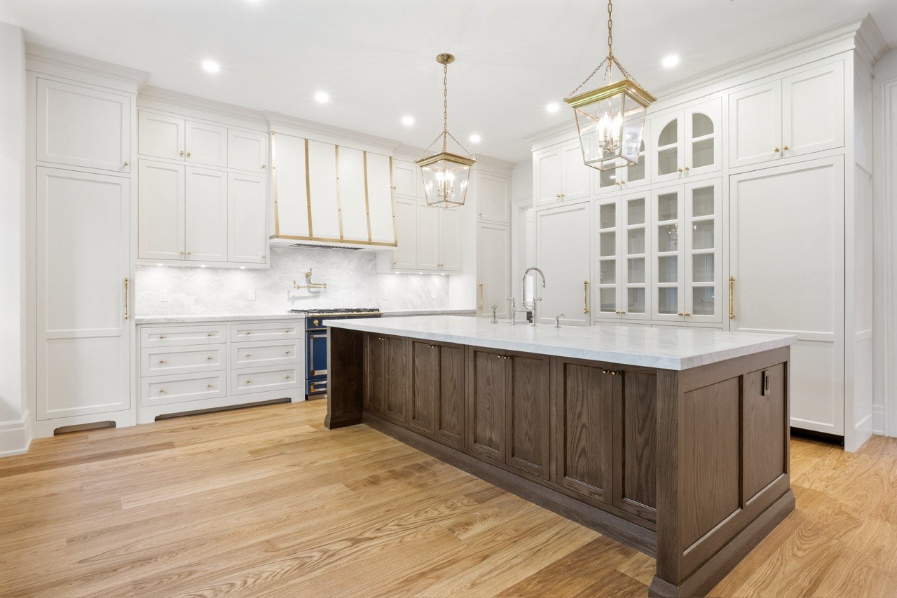 Modern rift-cut white oak kitchen with handleless cabinetry